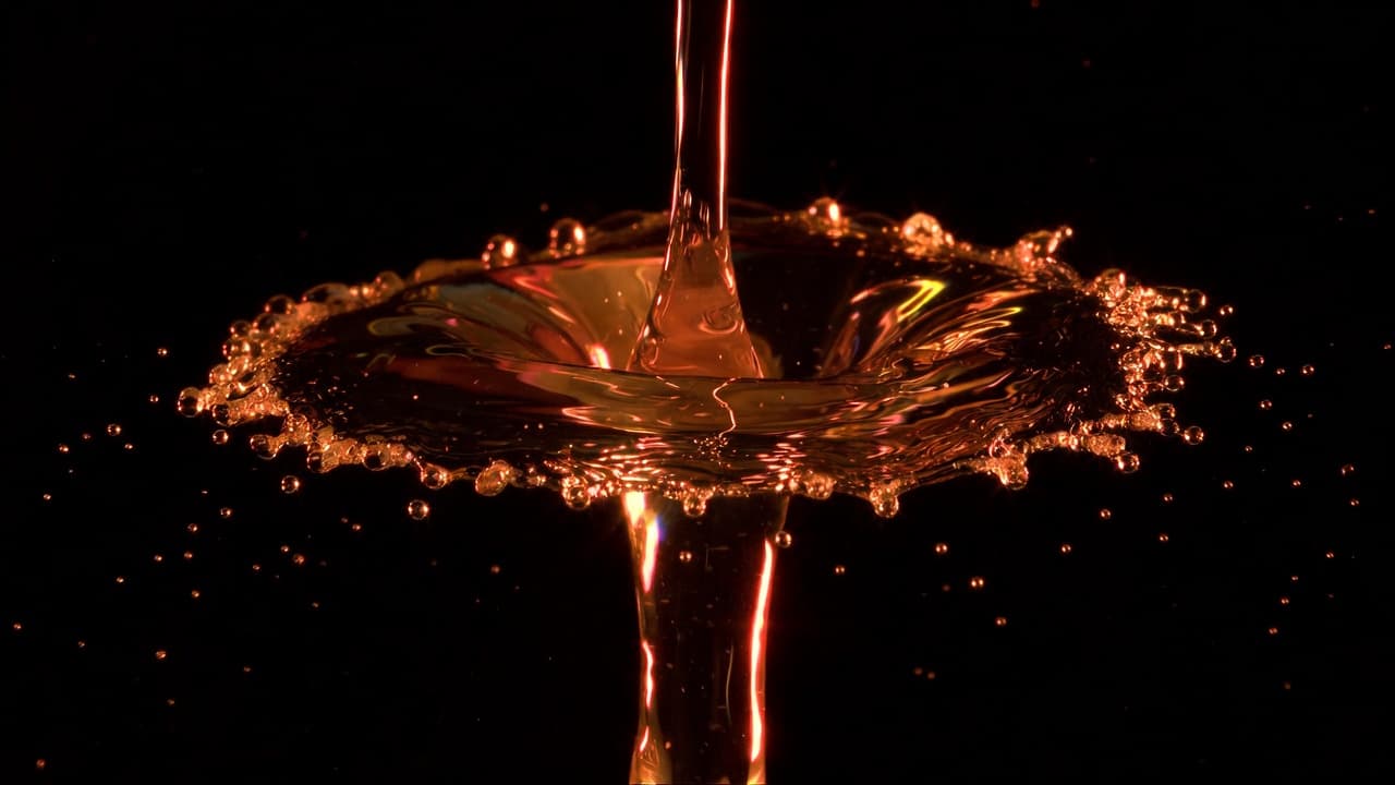 A beverage being poured into a glass
